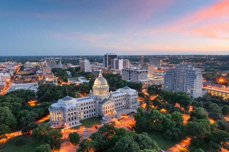 Jackson, Mississippi, USA skyline over the Capitol Building at dusk.
