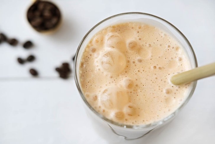 Cold coffee protein milkshake smoothie drink in a glass. collagen drink coffee flavored. healthy beverage for skin beauty and joints wealth. top view.